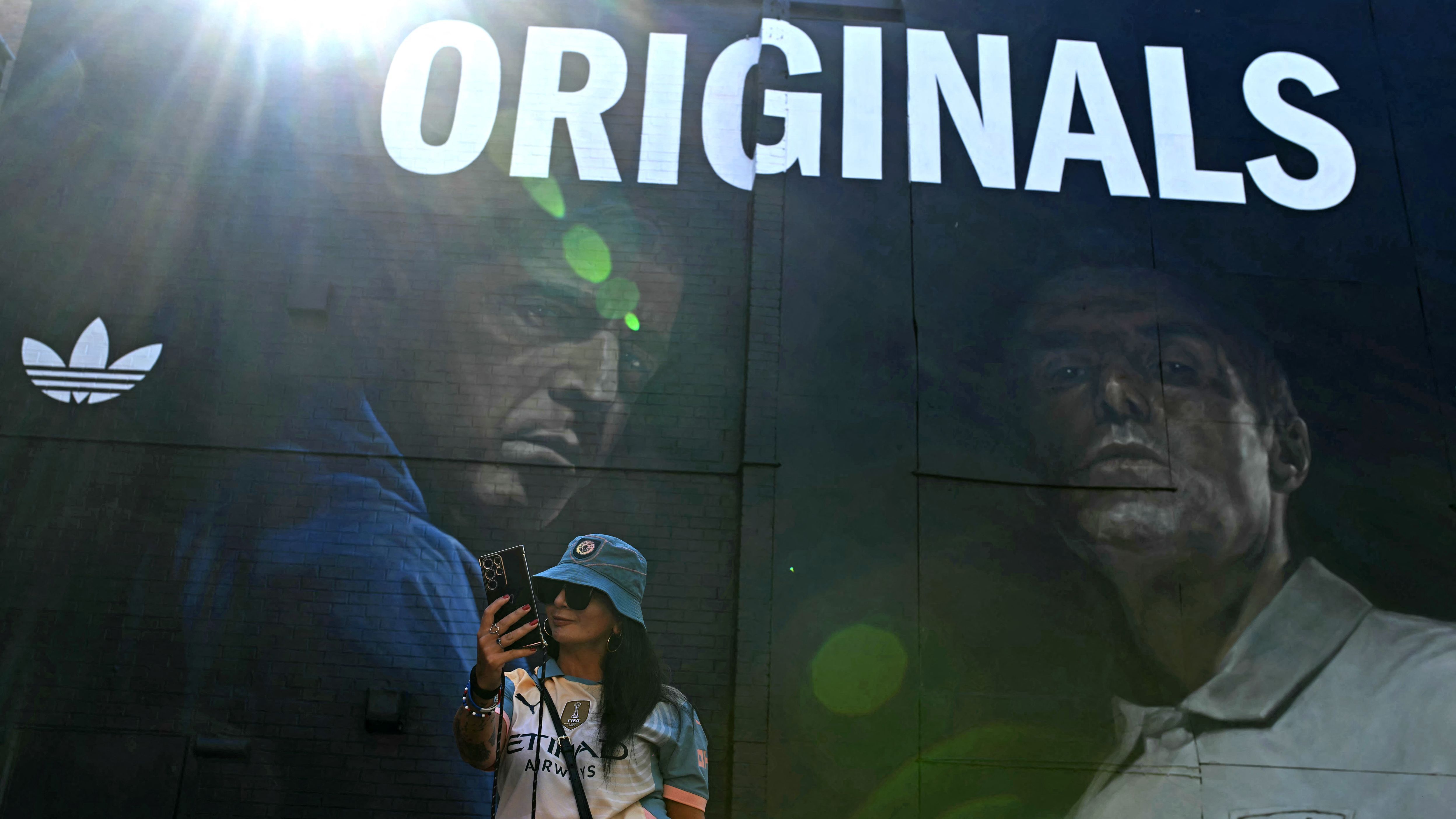 Pep Guardiola snapped backstage at Oasis gig in Heaton Park as Manchester City manager poses for pictures with Noel and Liam's children