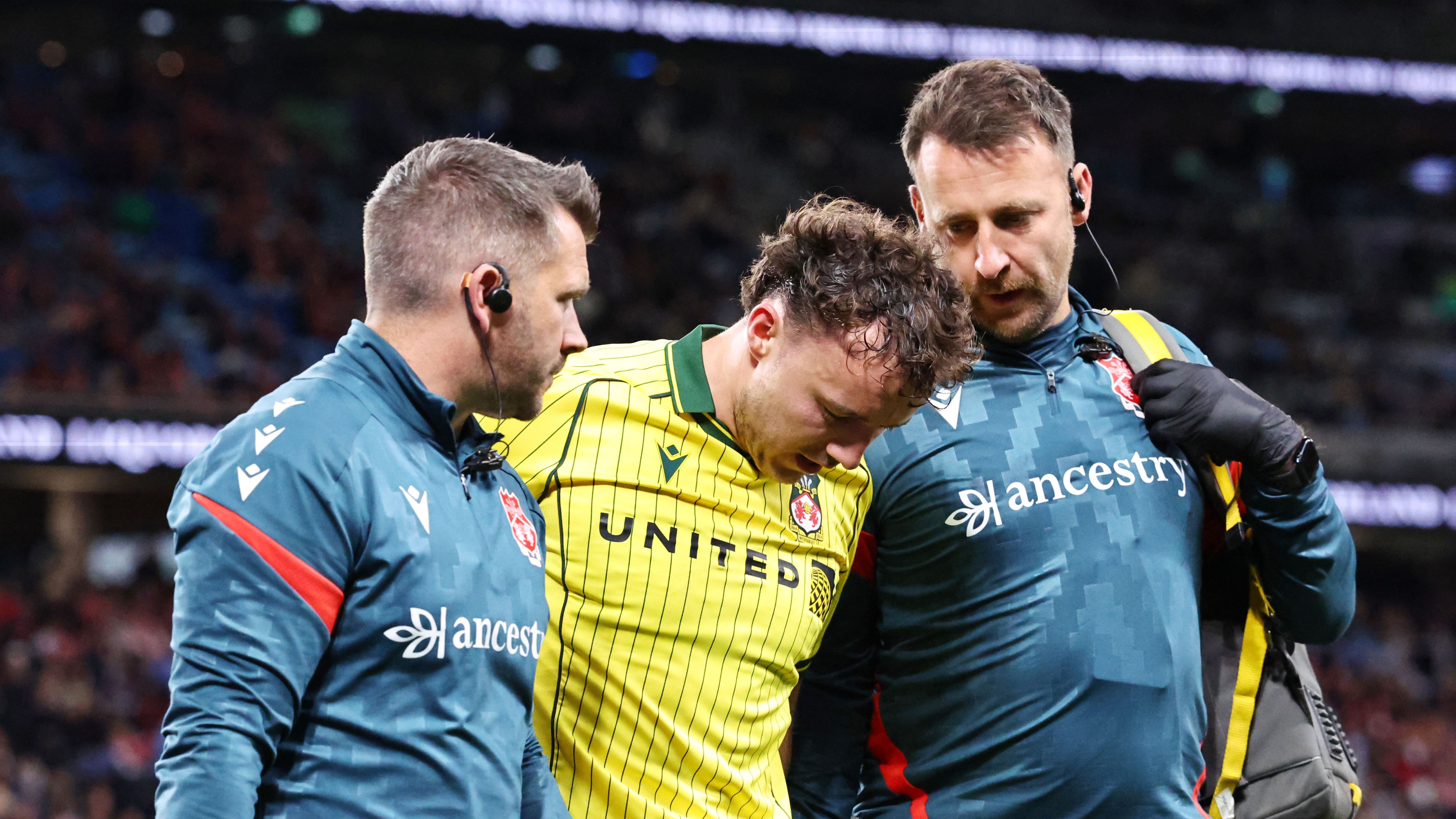 Wrexham talisman Ollie Rathbone rushed to hospital after nightmare injury blow in pre-season loss to Sydney FC as Phil Parkinson delivers worrying update