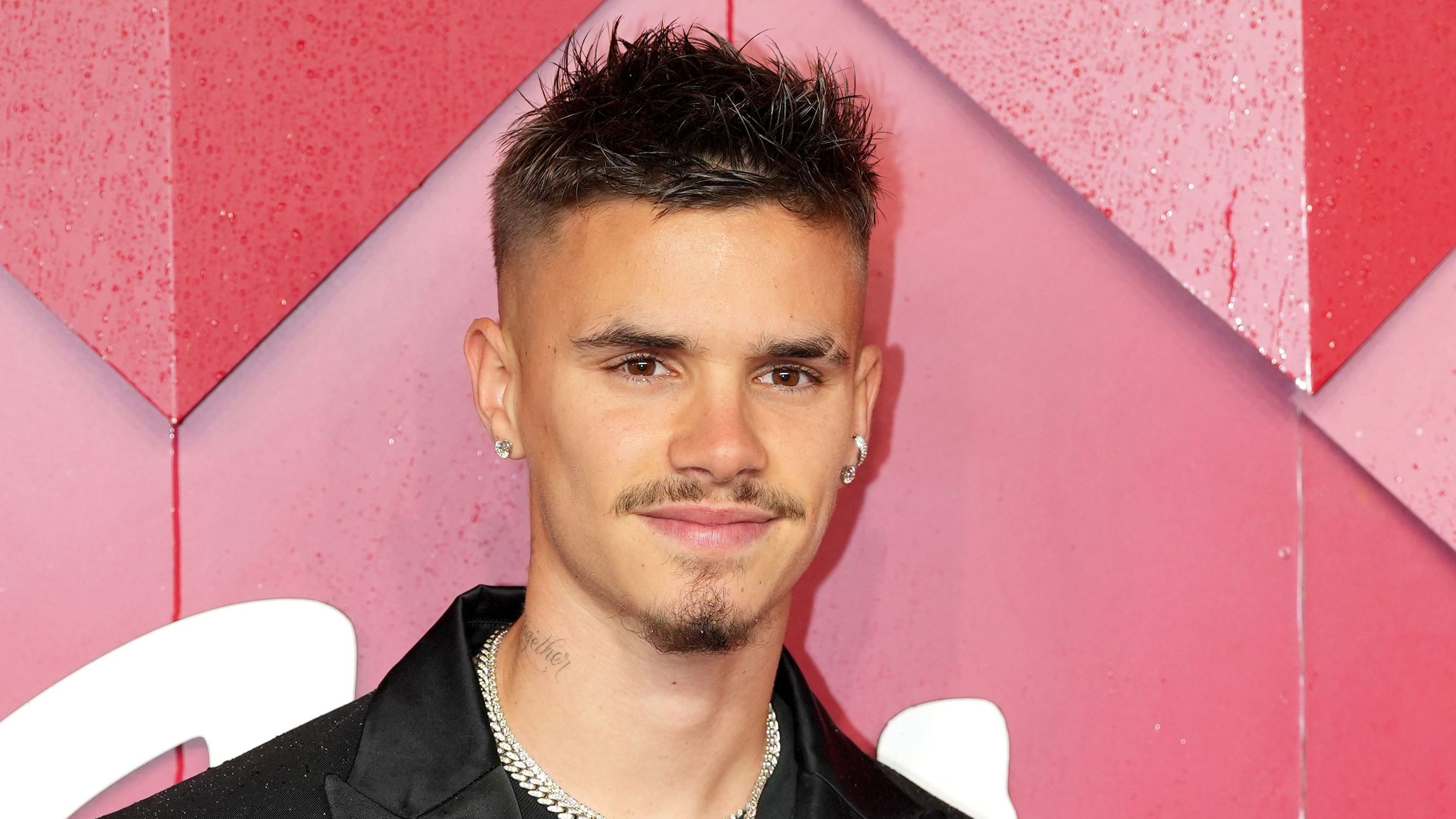 Don't Look Back In Anger! Romeo Beckham spotted at Oasis gig with Man City star