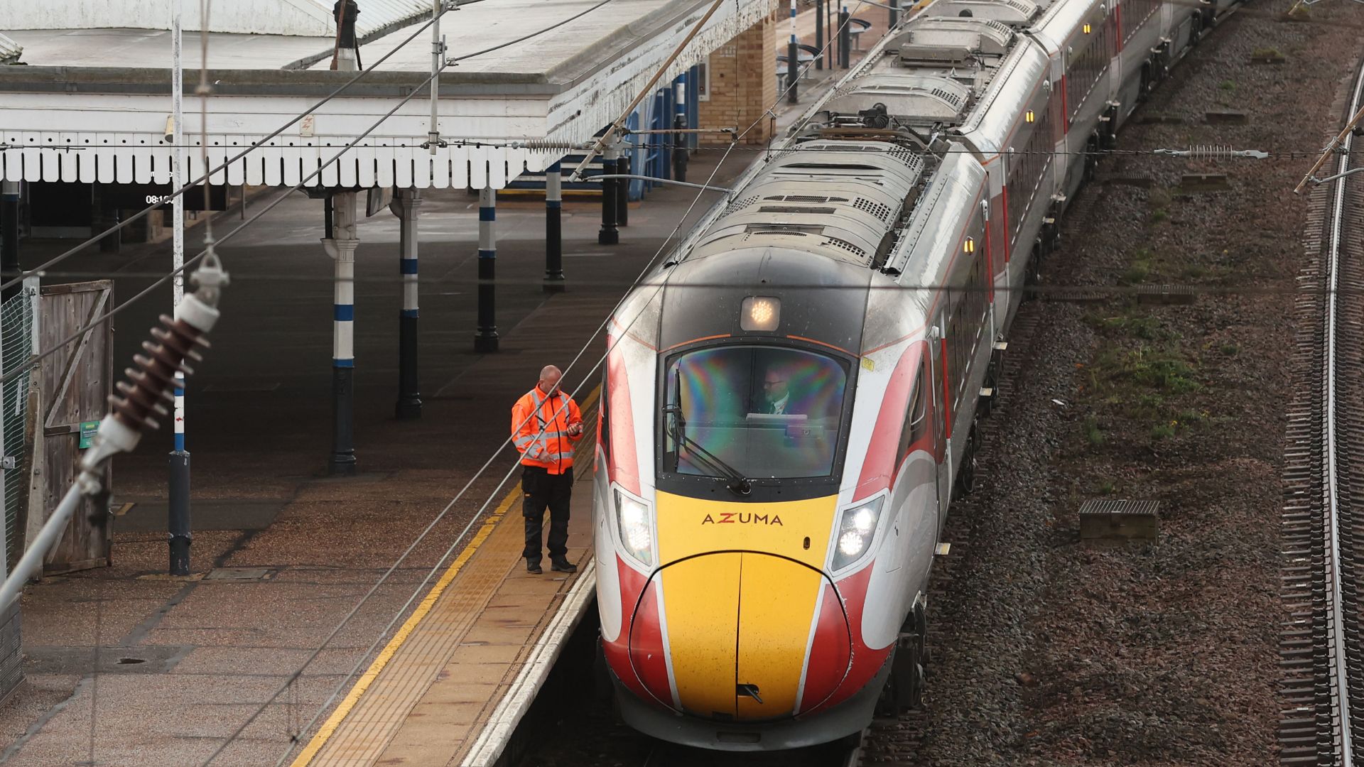 Footballer among victims of horror knife attack on London-bound train hospitalised after being 'slashed across bicep'