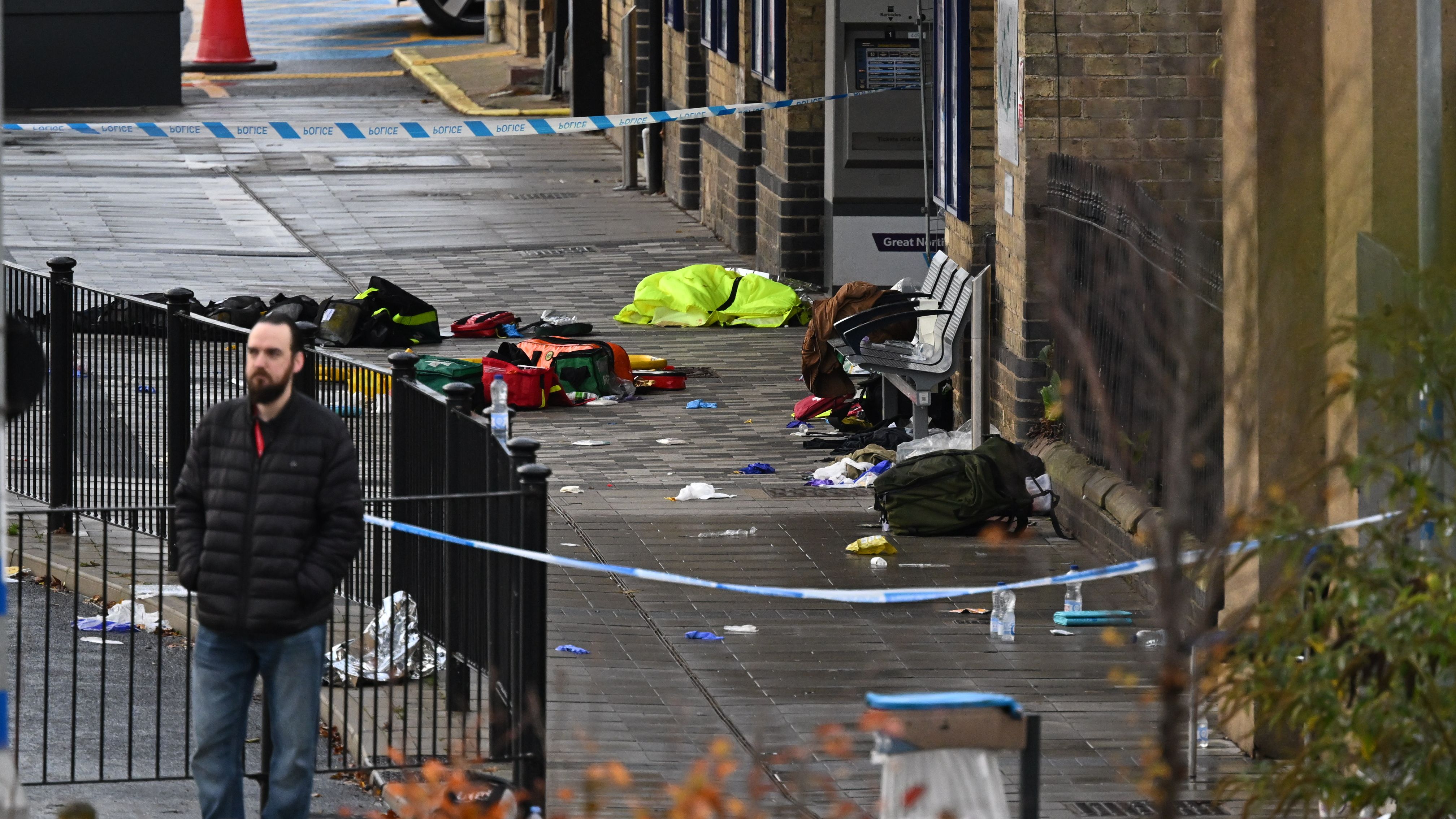 Footballer among victims of horror knife attack on London-bound train hospitalised after being 'slashed across bicep'