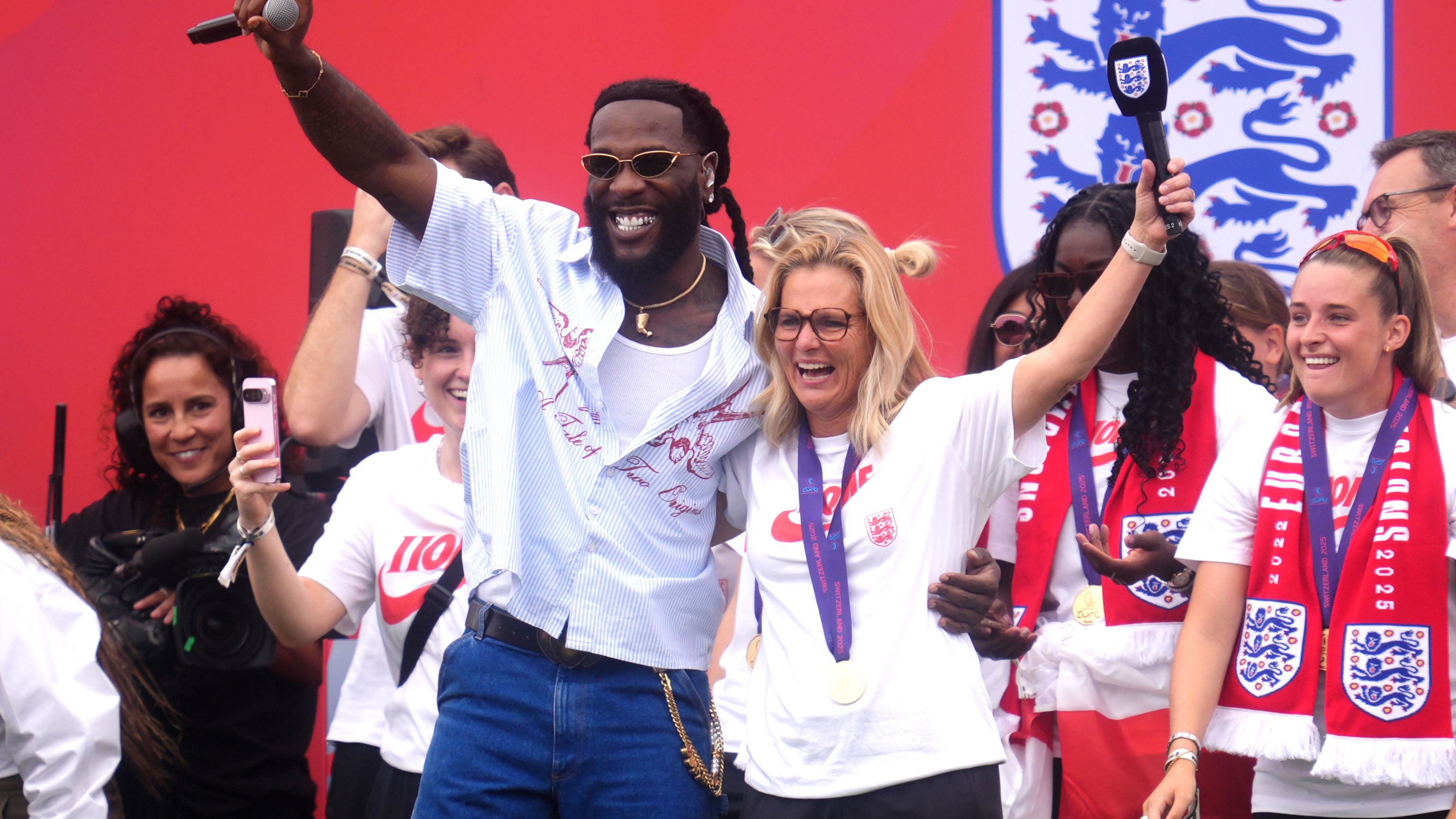 VIDEO: Sarina Wiegman dances & sings with Burna Boy as Lionesses boss surprised on stage by 'favourite artist' during Euro 2025 celebrations outside Buckingham Palace