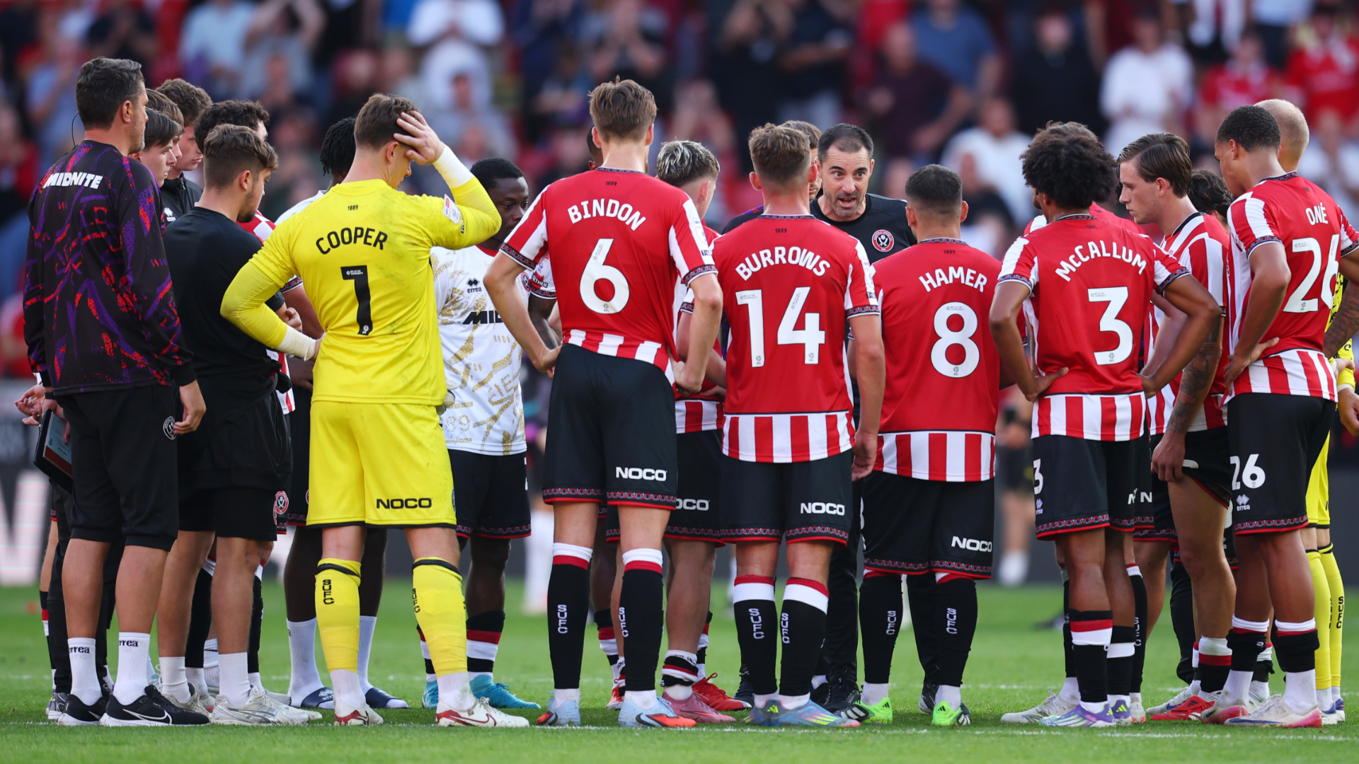 Former Premier League boss conducts post-match team talk on the pitch after thumping defeat in opening round of Championship fixtures