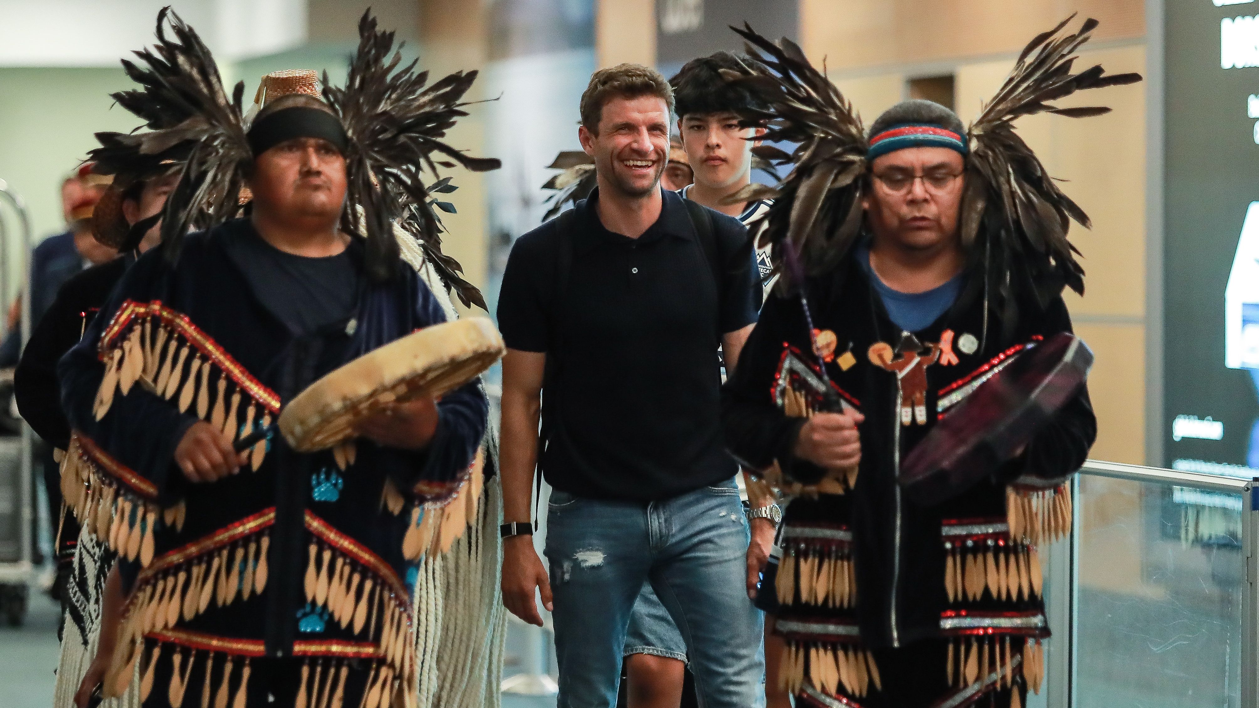 Thomas Muller gets a hero's welcome as Vancouver Whitecaps go wild for Bayern Munich legend after he arrives in Canada