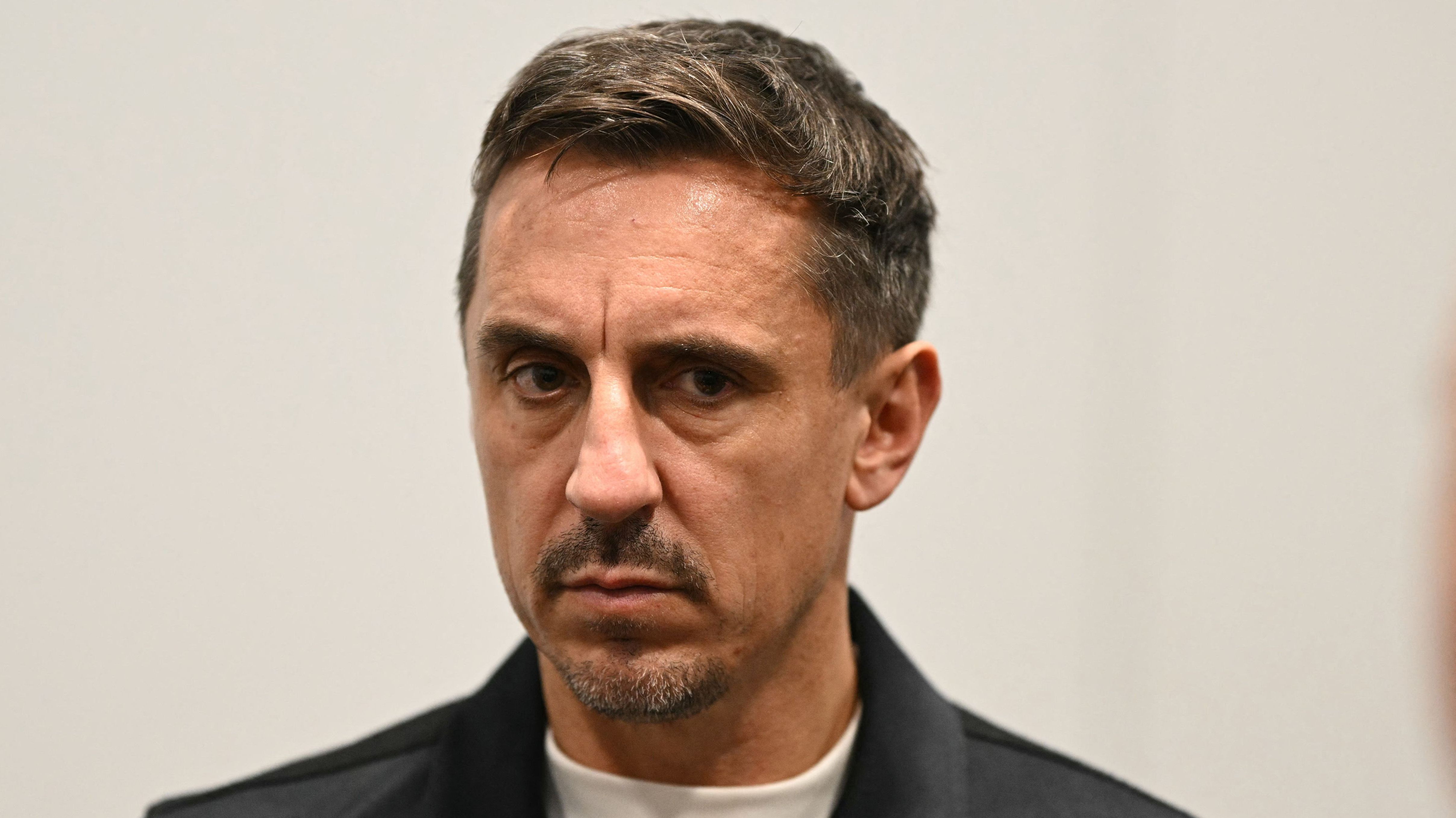 Three arrests made after pitch invaders force Salford match to be halted due to protests against co-owner Gary Neville